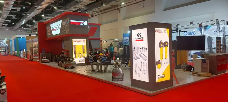 El Haggar — A stand for a compressed-air technology supplier, displaying compressors and industrial equipment.