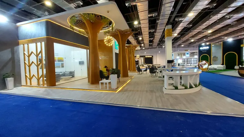 El Komy Group — A stand for a sustainable-agriculture group, with an organic, tree-column design.