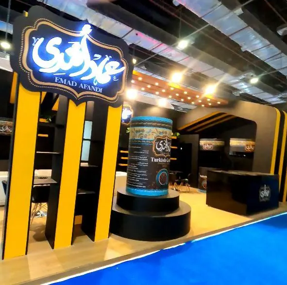 Emad Afandi — A heritage-style stand for a coffee and food brand, with a product display podium.