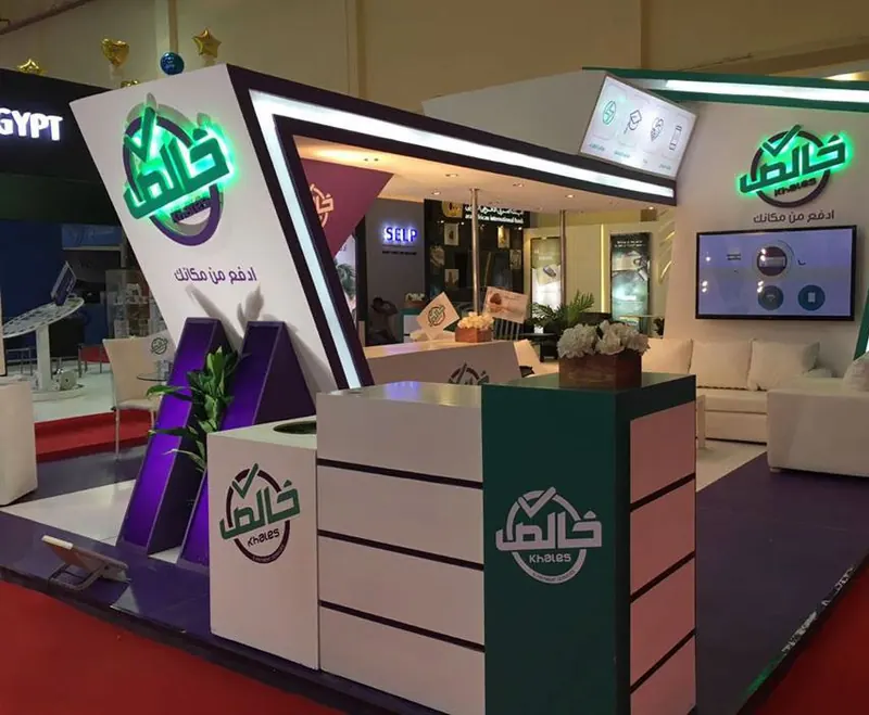 Khales — A stand for a digital-payments service, with interactive demo zones.