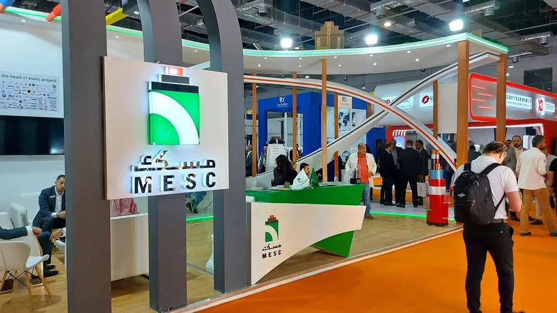 MESC — A stand for a cable company, with a curved façade and a reception and meeting area.