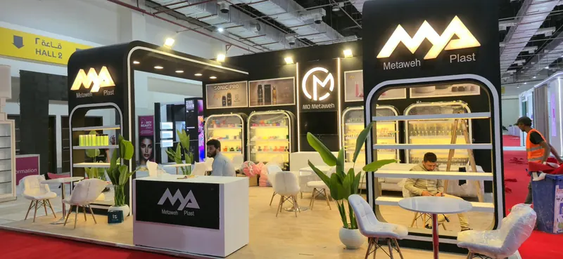 Metaweh Plast 2026 — Illuminated display frames with rounded edges on a black identity, built for Egy Beauty 2026.