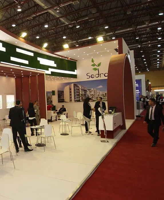 Sedrah — A stand for a residential-compound developer, with project displays and a sales area.